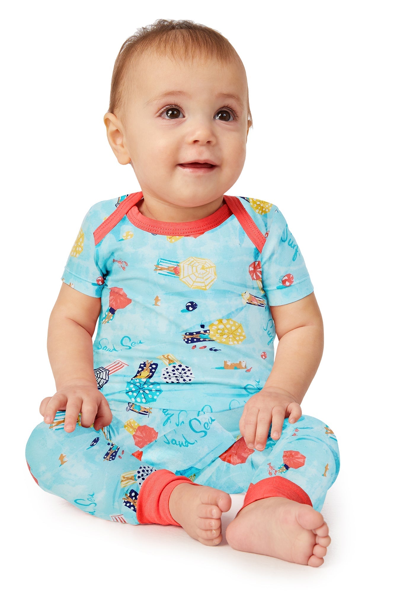 A baby wearing a short sleeve pj set with sunny day pattern.