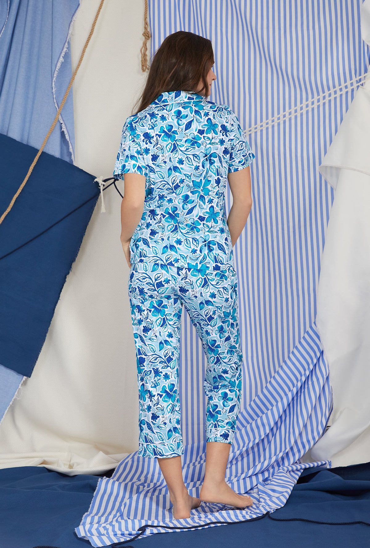 A lady wearing white short sleeve classic cropped pj set with marine meadows print.