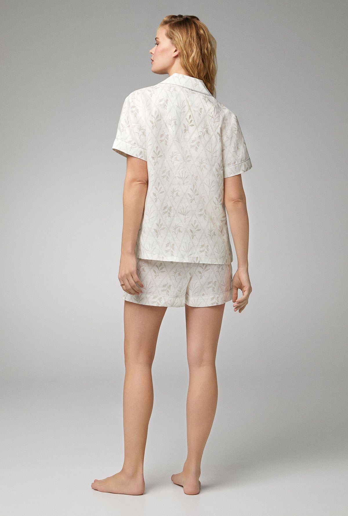 A lady wearing Short Sleeve Classic Woven Linen Shorty PJ Set with Botanical Studies print