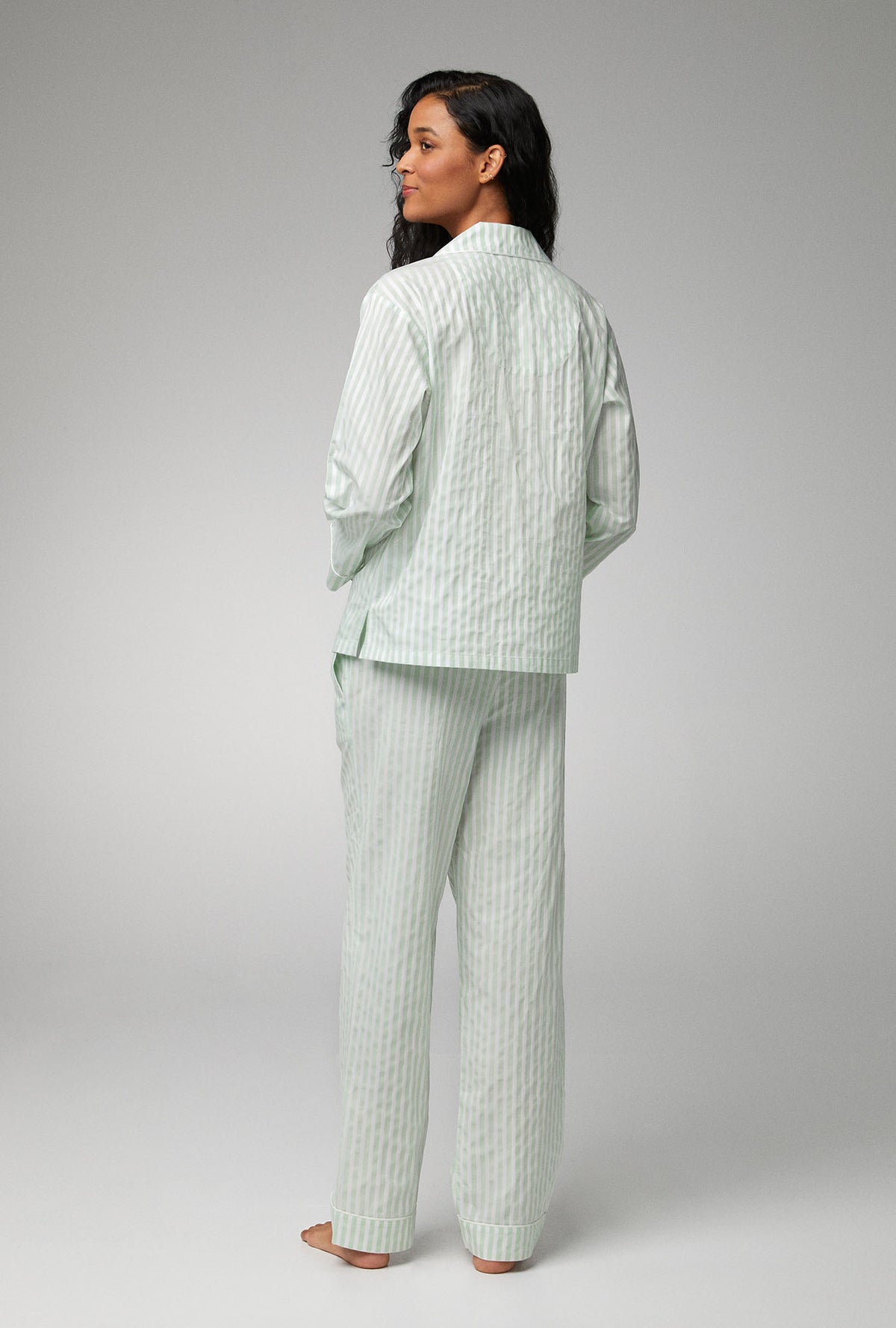 A lady wearing green Long Sleeve Classic Woven Cotton Sateen PJ Set with Mint 3D Stripe print
