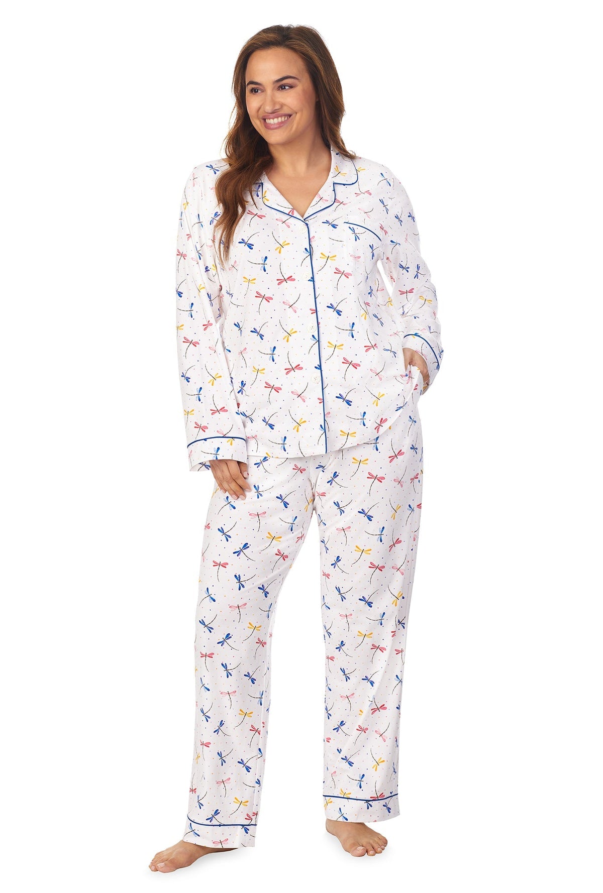 A lady wearing a white long sleeve plus size pj set with dragonfly pattern.