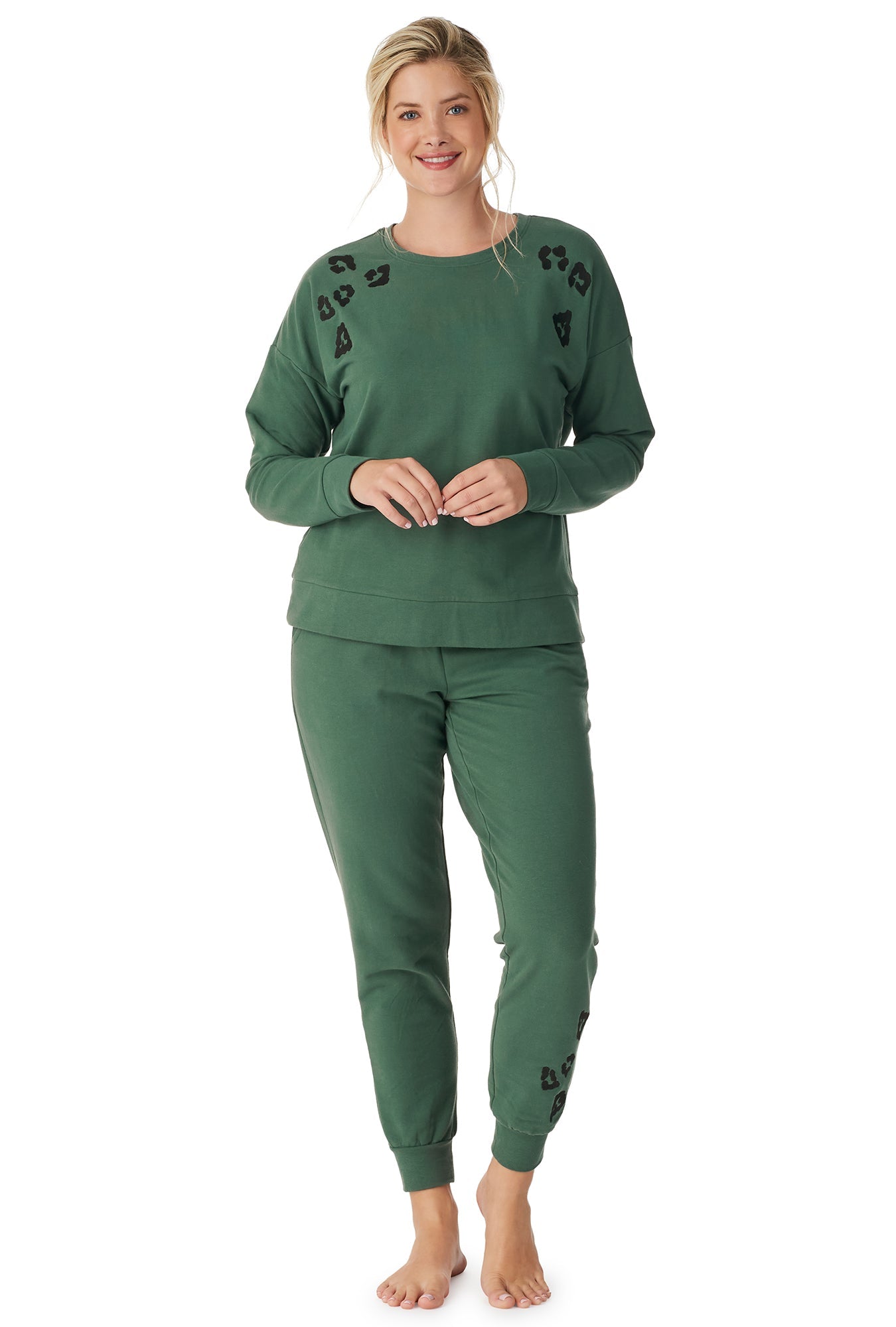A lady wearing a green long sleeve crew embroidered lounge set.