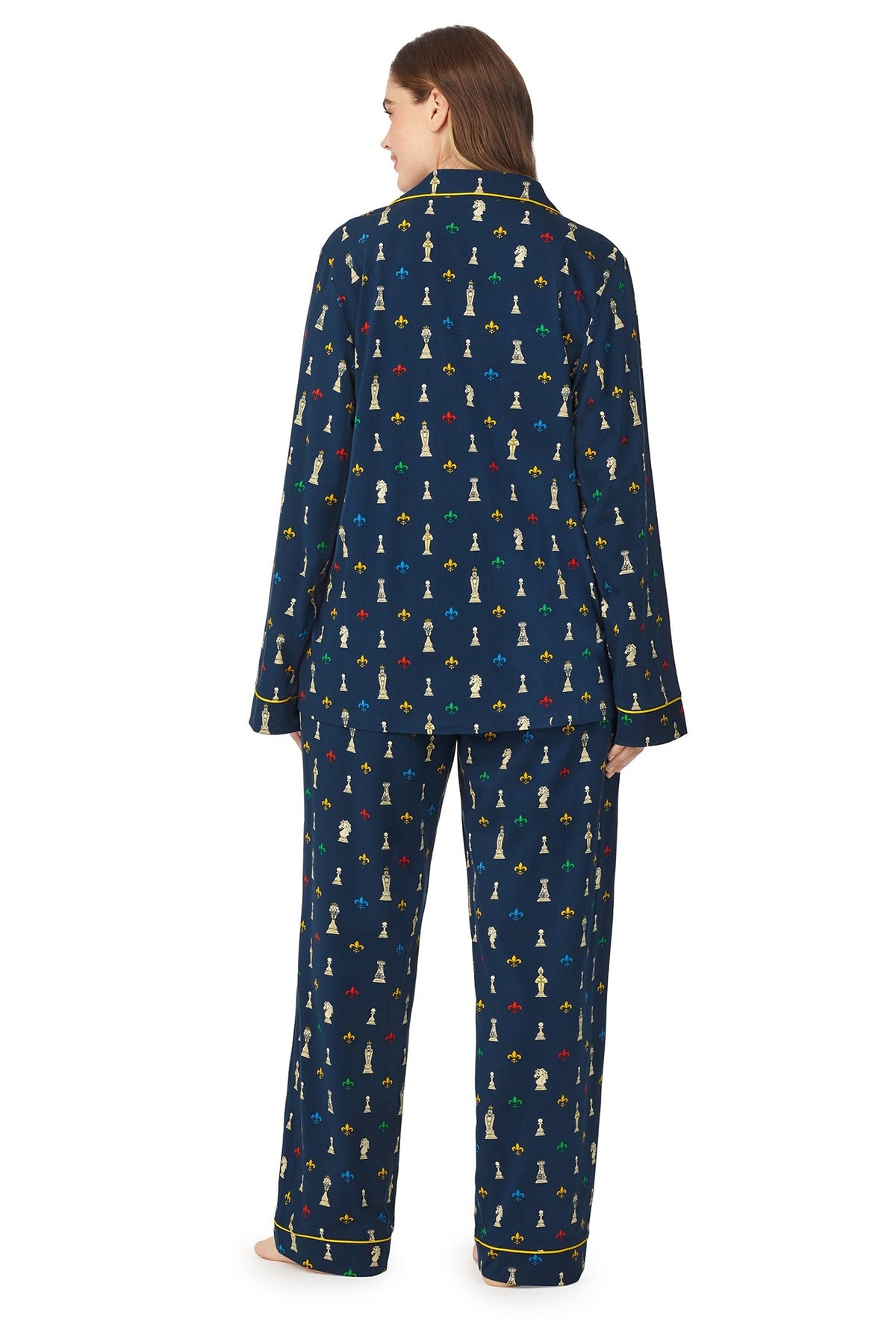 A girl wearing a navy blue long sleeve stretch jersey pj set plus size with checkmate pattern.