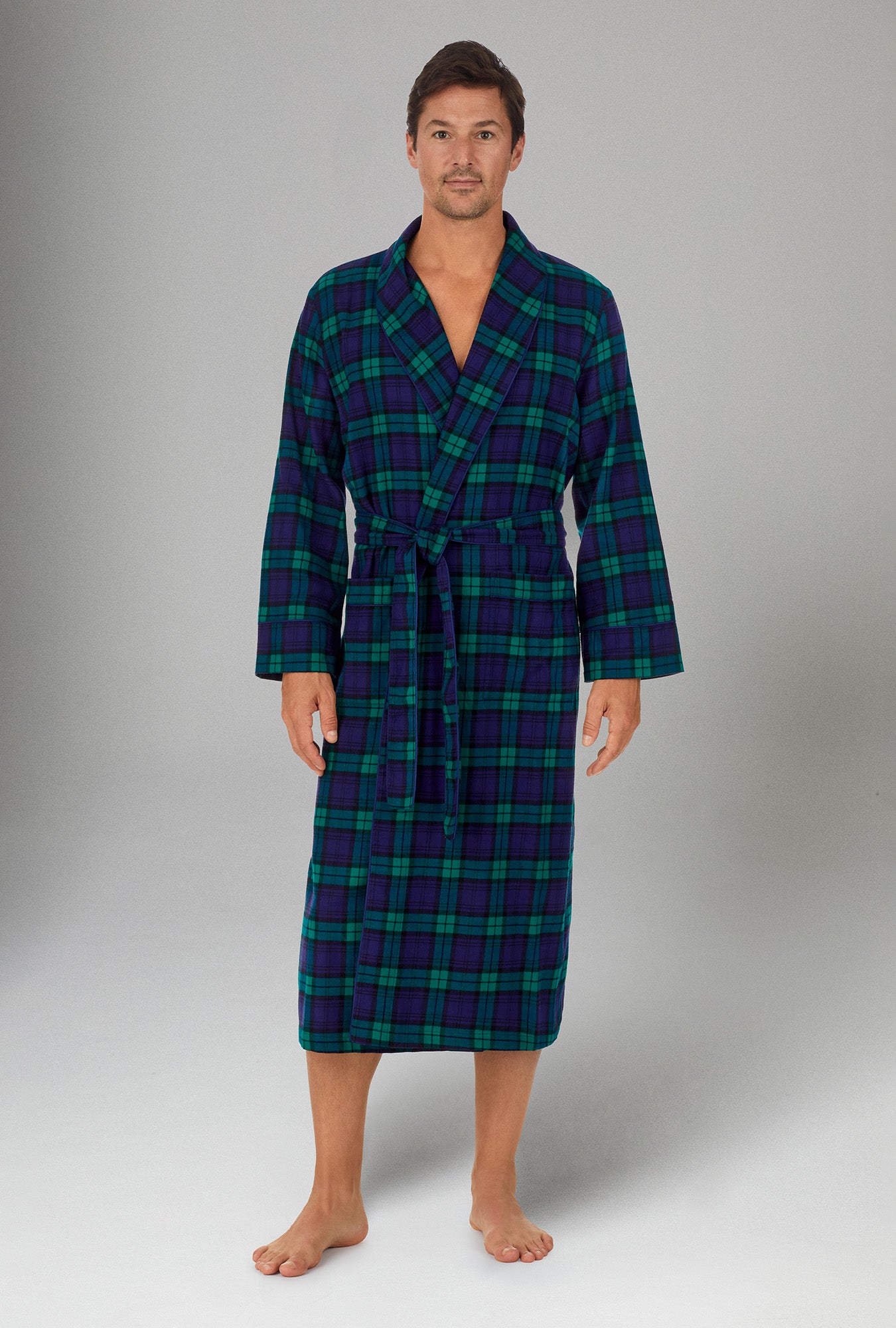 A man wearing navy long sleeve henley woven cotton portuguess flannel pj set with highlander print.