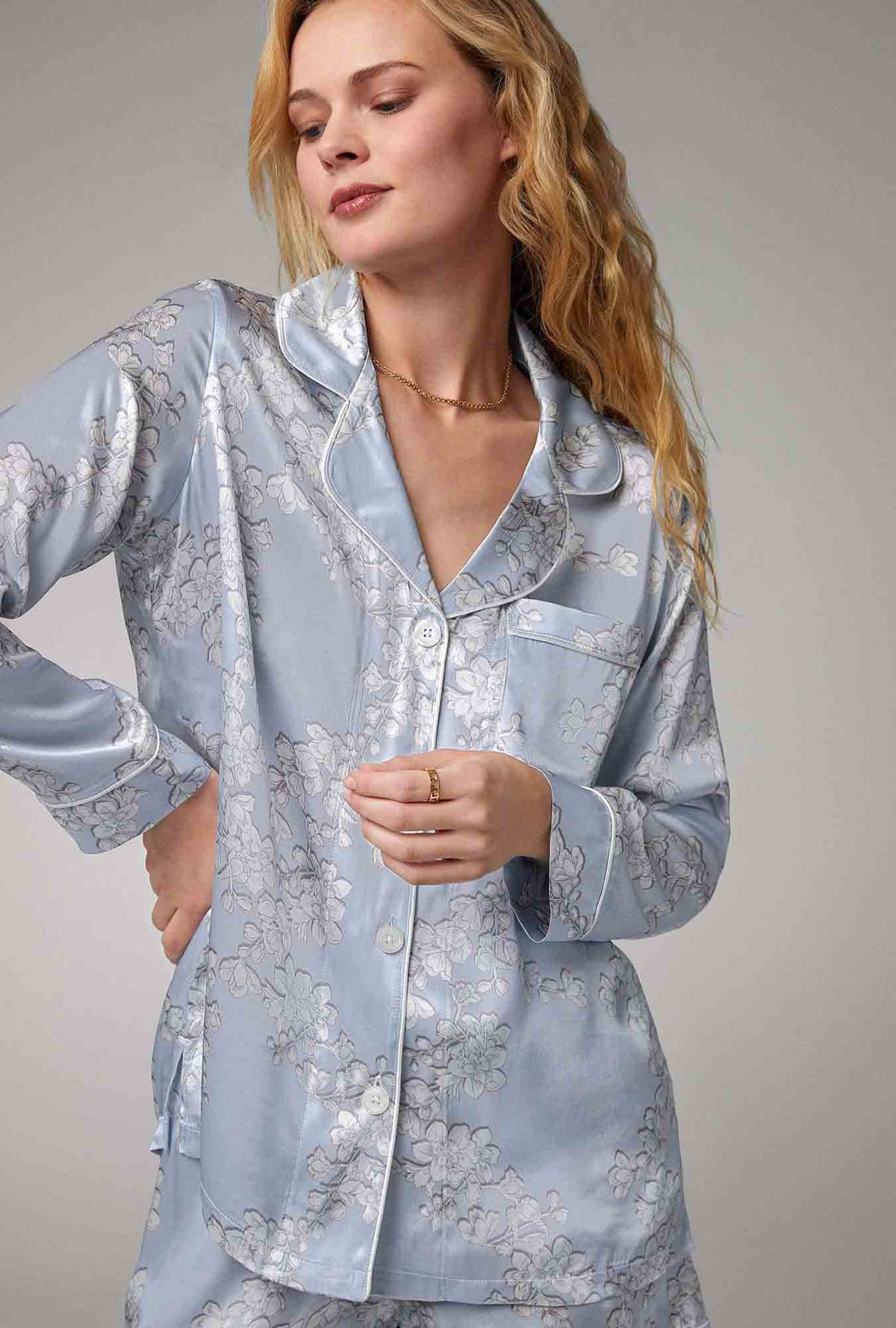 A lady wearing blue long sleeve classic woven silk satin shorty pj set with renee&#39;s blossom print