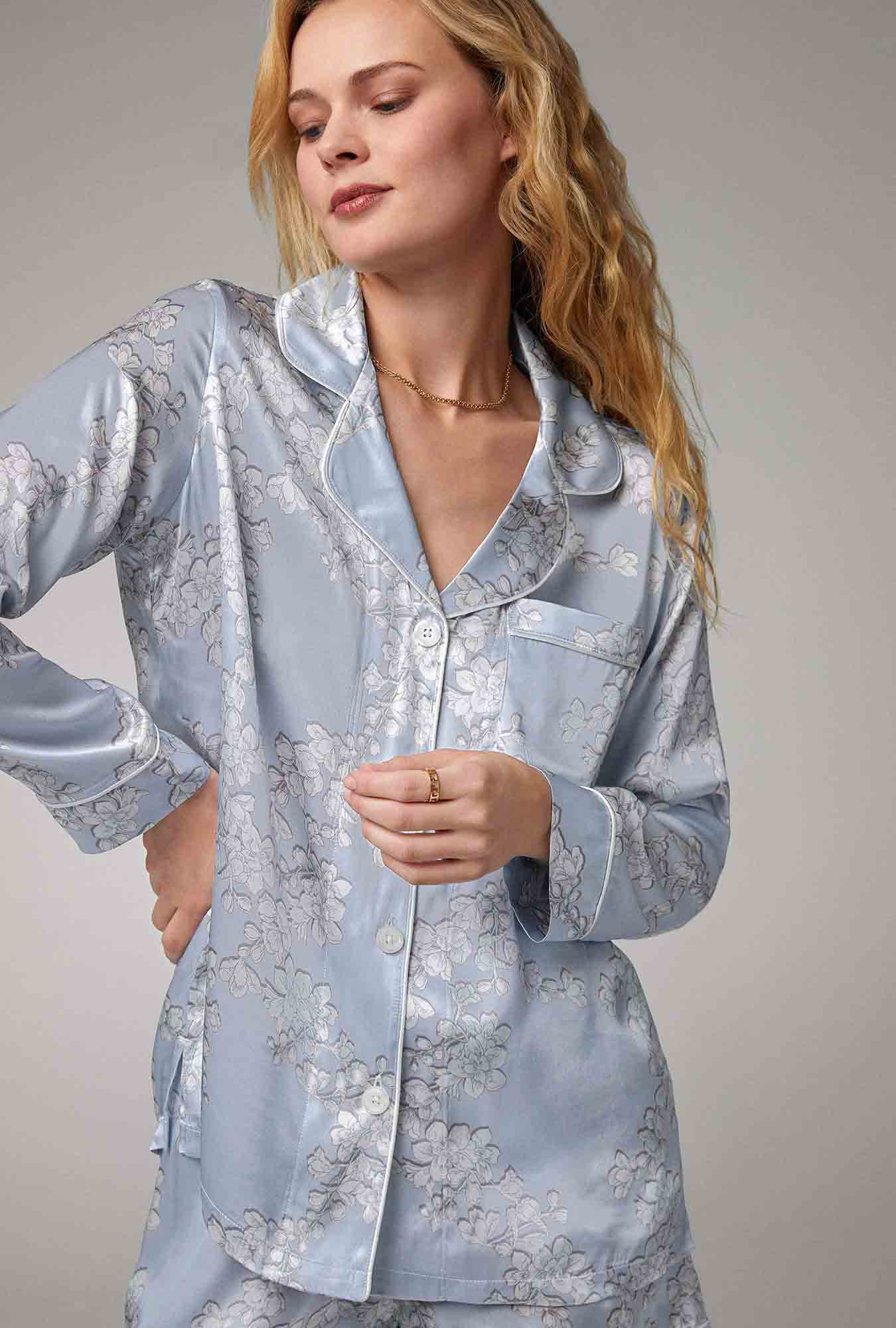 A lady wearing blue long sleeve classic woven silk satin shorty pj set with renee's blossom print