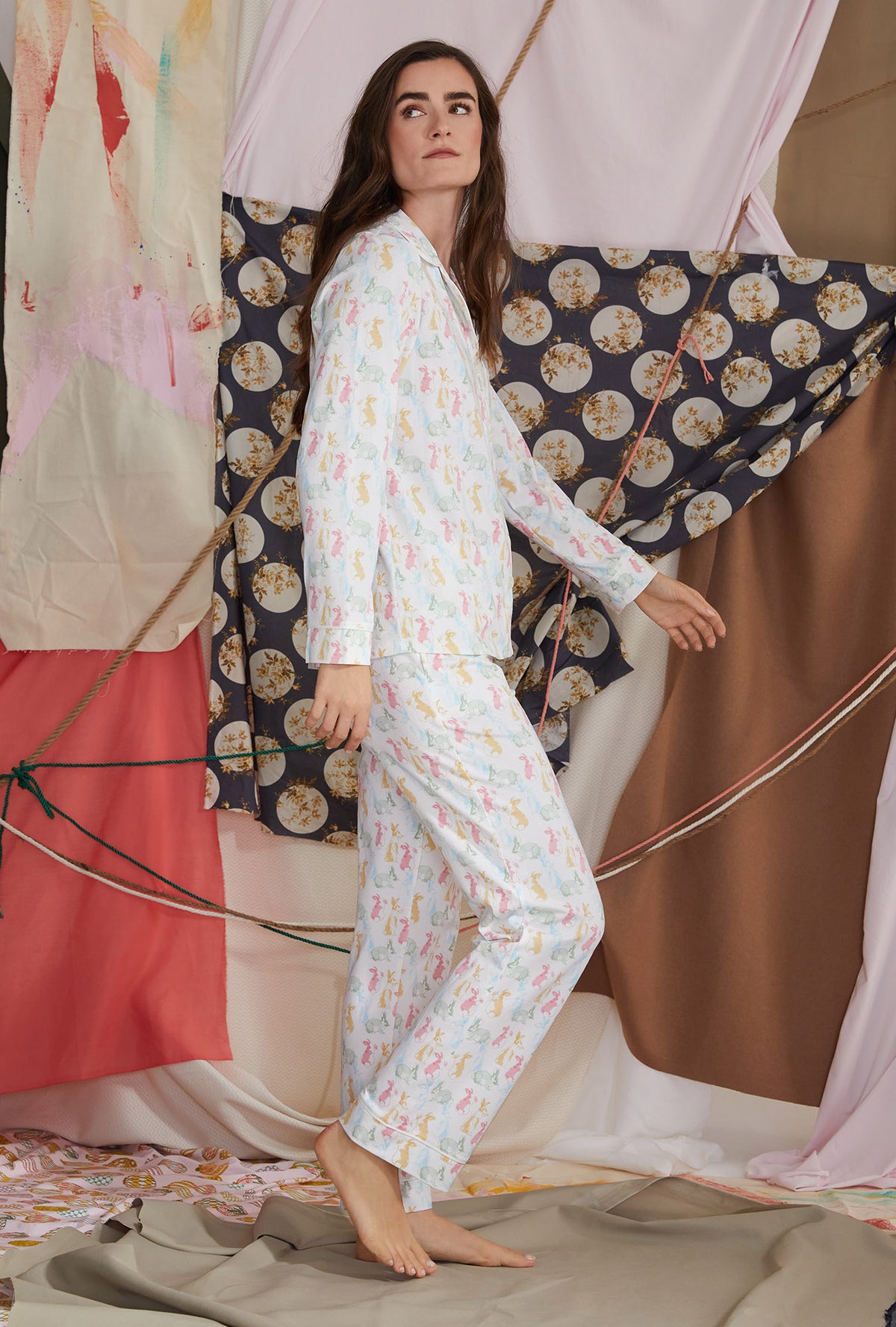A lady wearing white long sleeve classic pj set with cottontail print