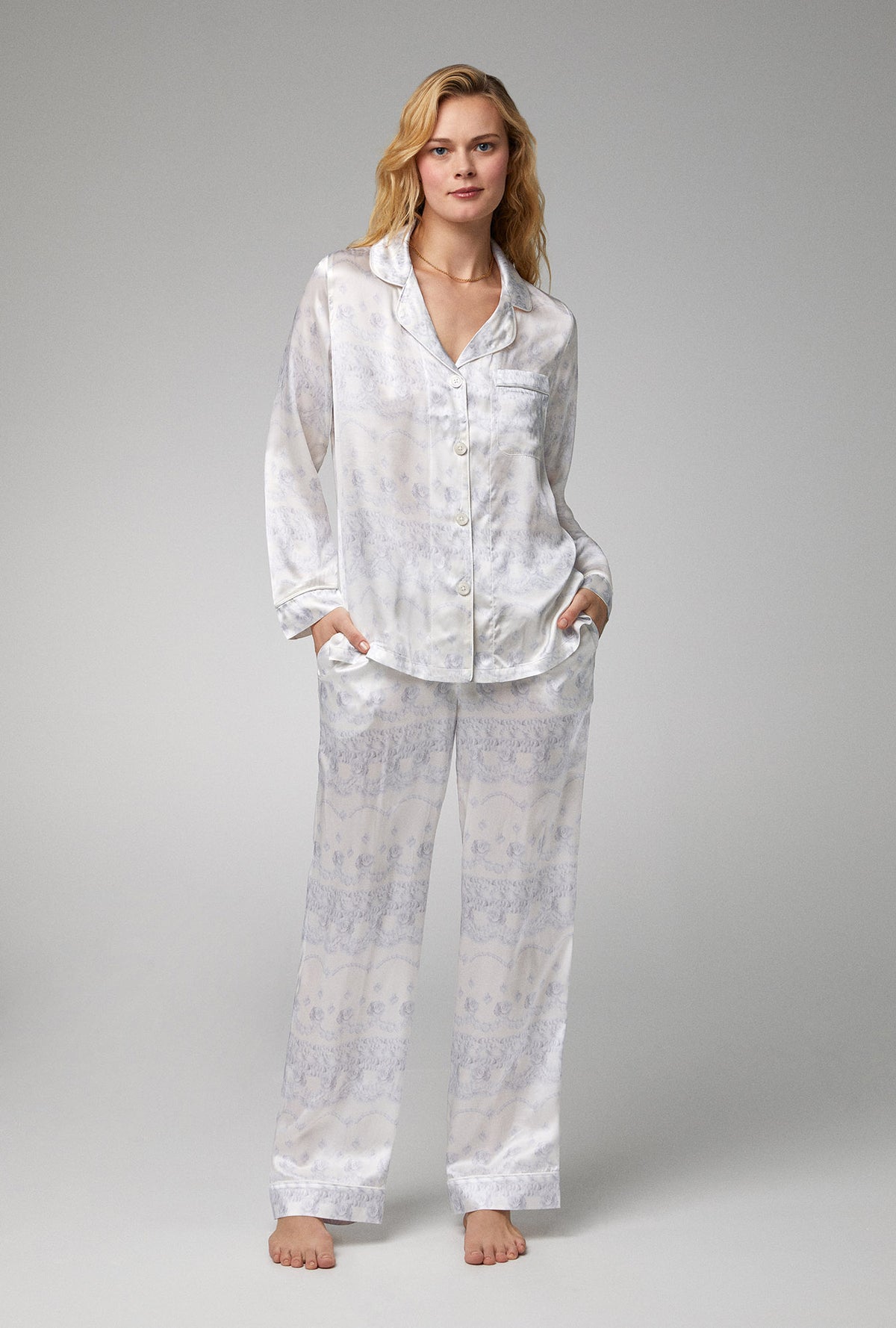 A lady wearing white long sleeve classic woven silk satin pj set with buttercream  print