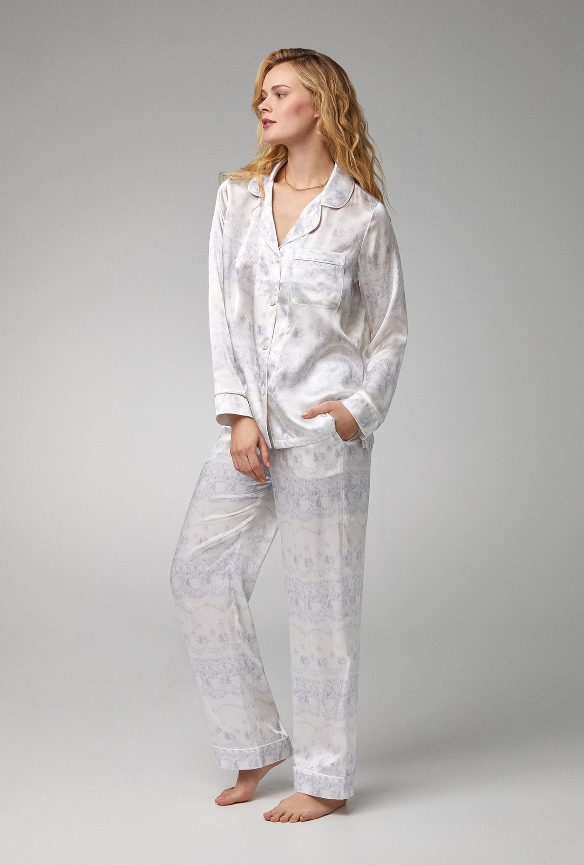 A lady wearing white long sleeve classic woven silk satin pj set with buttercream print