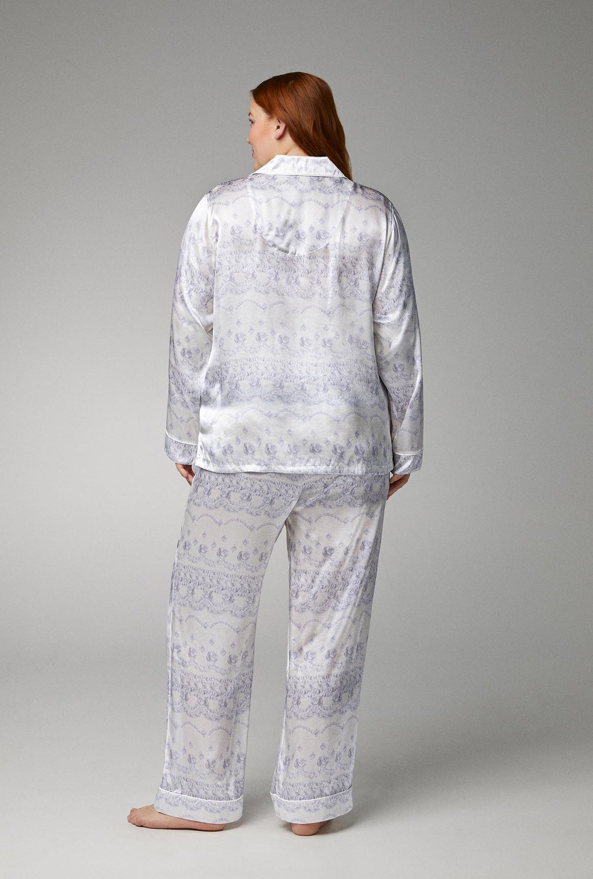 A lady wearing white long sleeve classic woven silk satin pj set with buttercream print