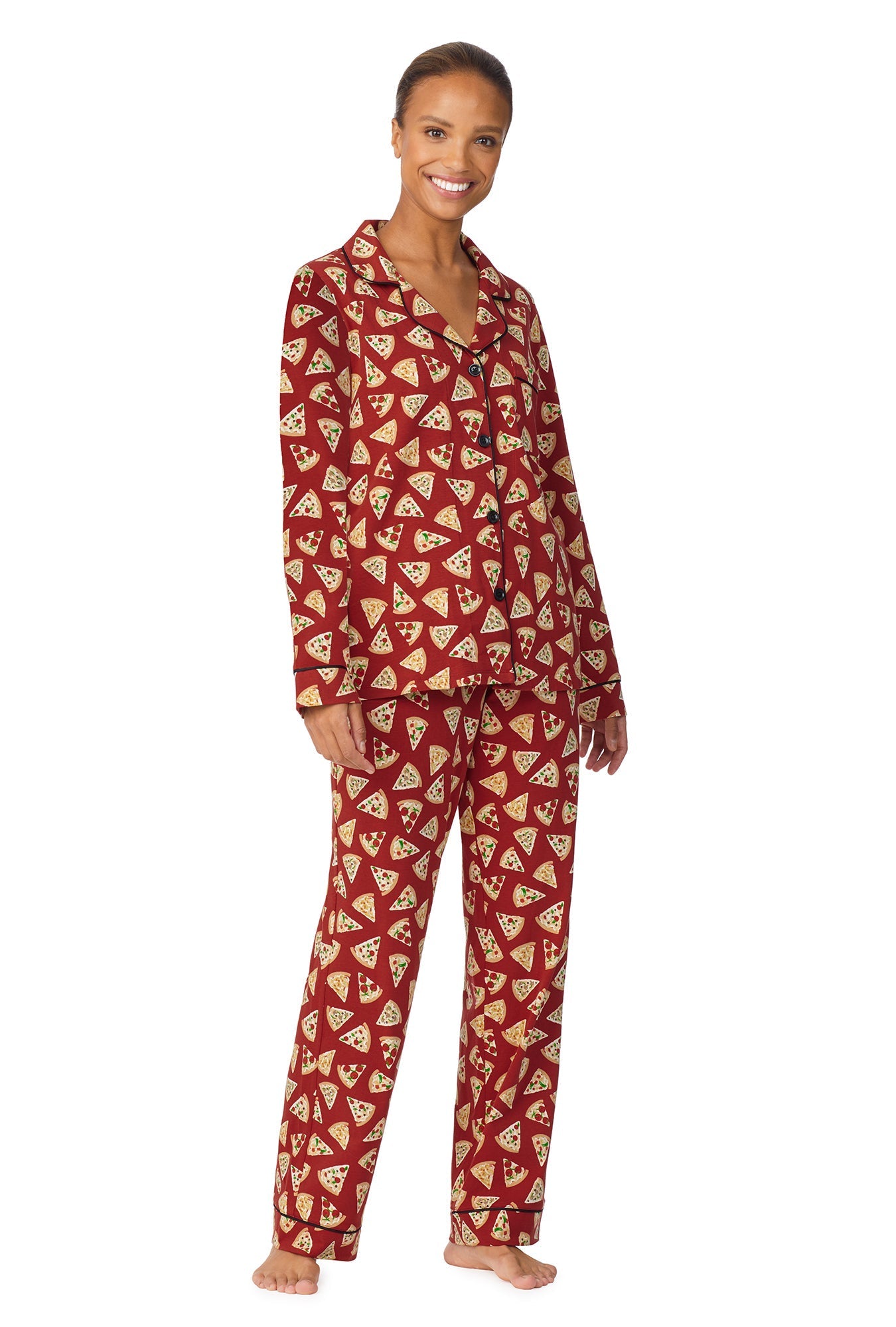 A lady wearing a brown long sleeve pj set with pizza pattern.