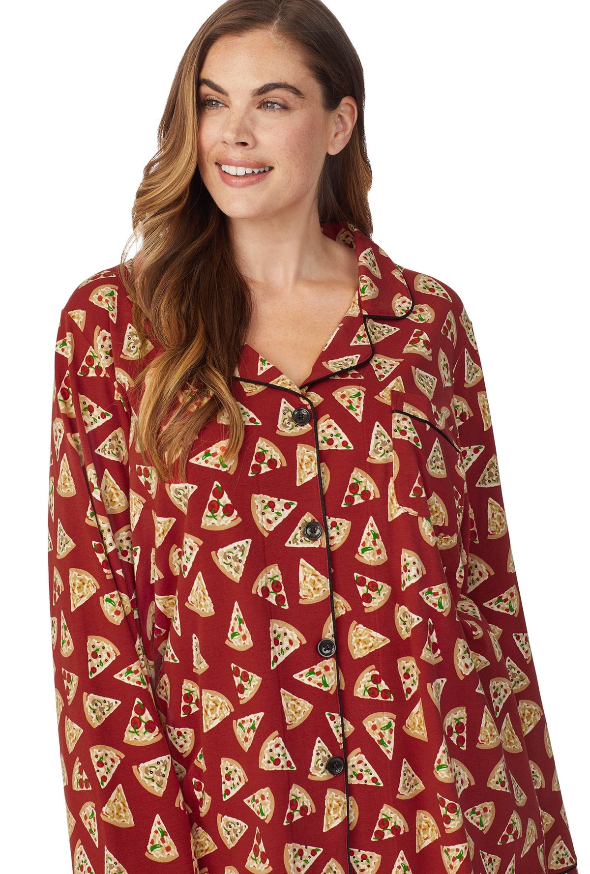 A lady wearing a brown long sleeve plus size pj set with pizza pattern.