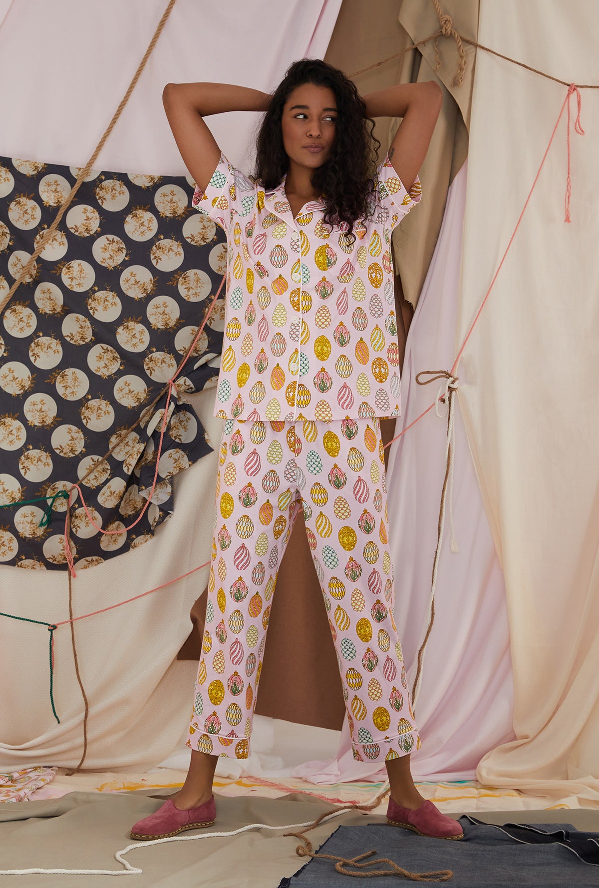 A lady wearing white short sleeve cropped pj set with egg hunt print
