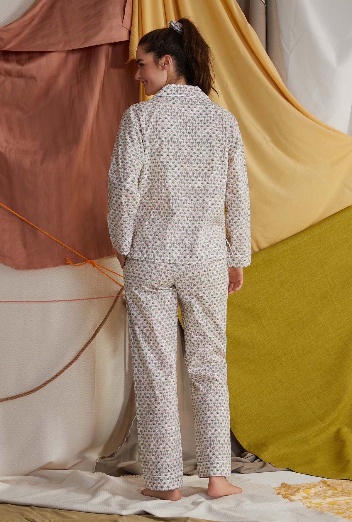 A lady wearing multicolor long sleeve clasic woven cotton poplin pj set with palm geo print.