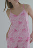 A lady wearing pink sleeveless cropped pj set with elegant print 