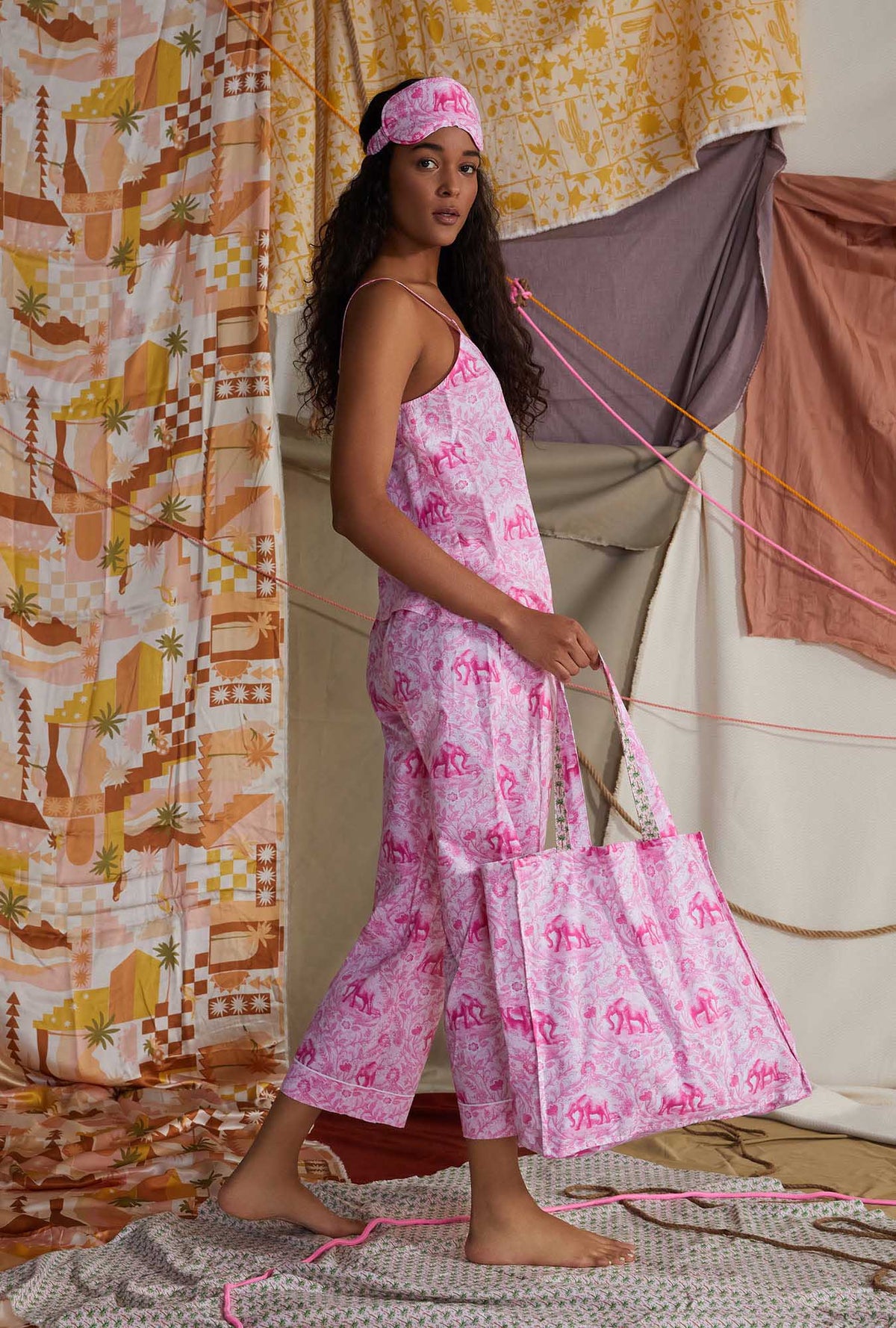 A lady wearing pink sleeveless cropped pj set with elegant print 