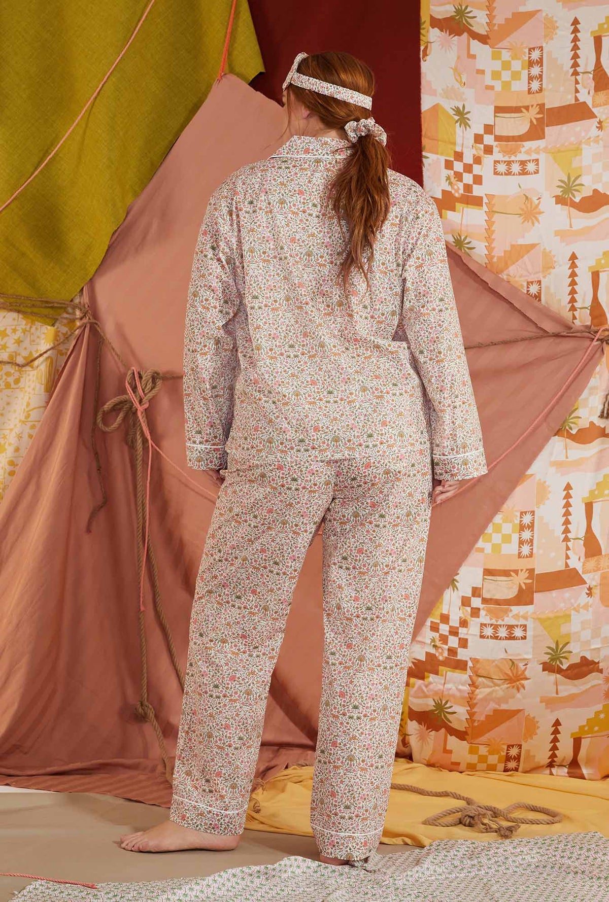 A lady wearing multi color long sleeve tana lawn classic plus size pj set with imran print.