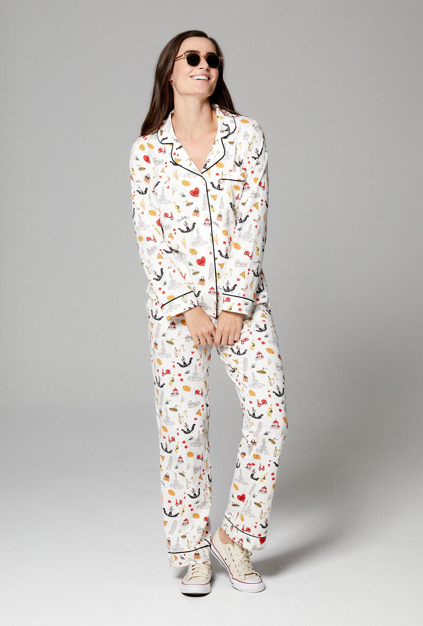 A lady wearing ivory long sleeve classic pj set with that's amore print