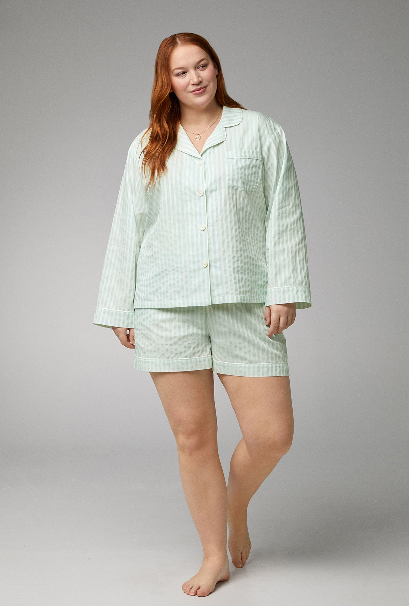 A lady wearing Long Sleeve Classic Woven Cotton Sateen Shorty PJ Set with Mint 3D Stripe print
