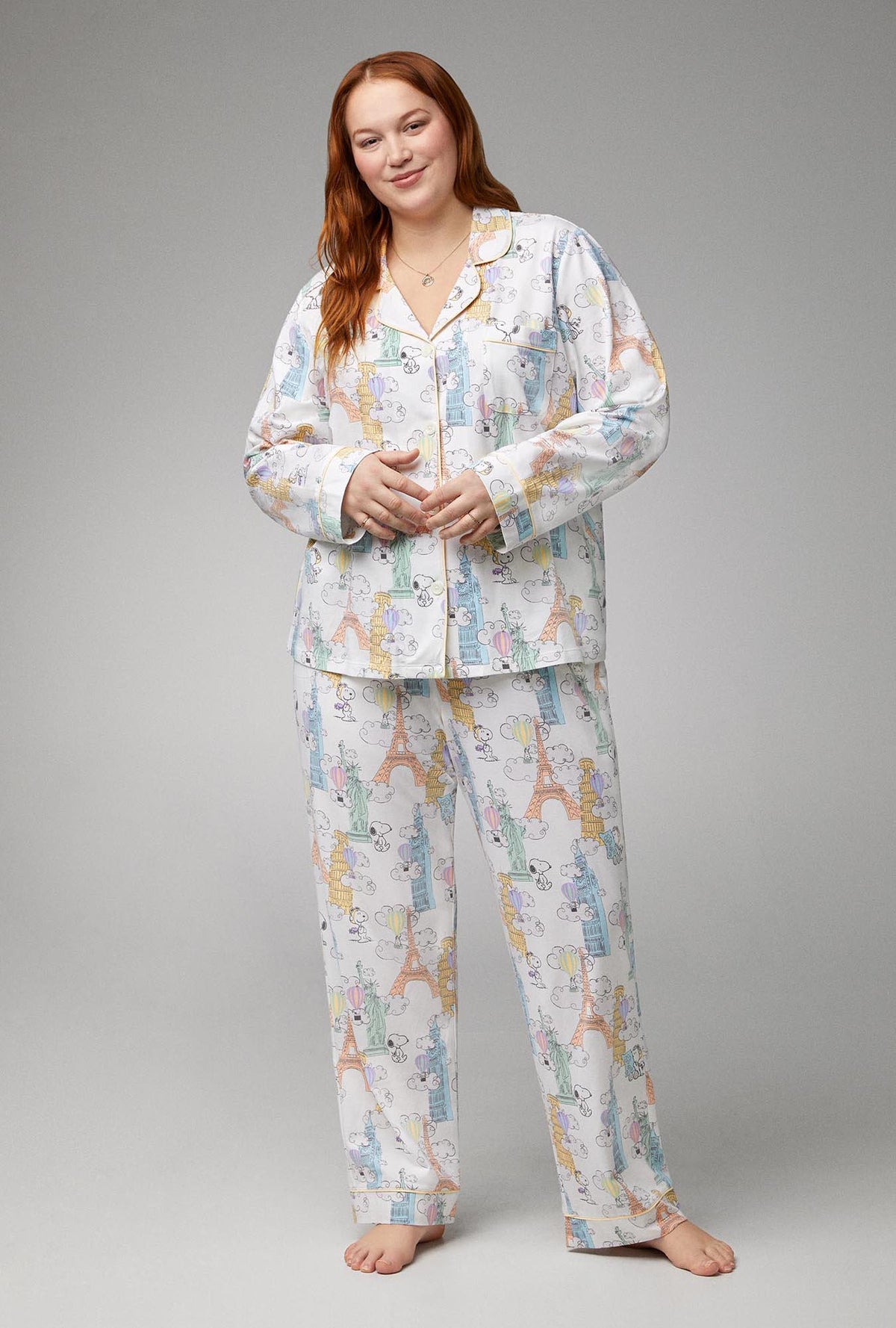 A lady wearing white  Long Sleeve Classic Stretch Jersey PJ Set with Bon Voyage Snoopy print